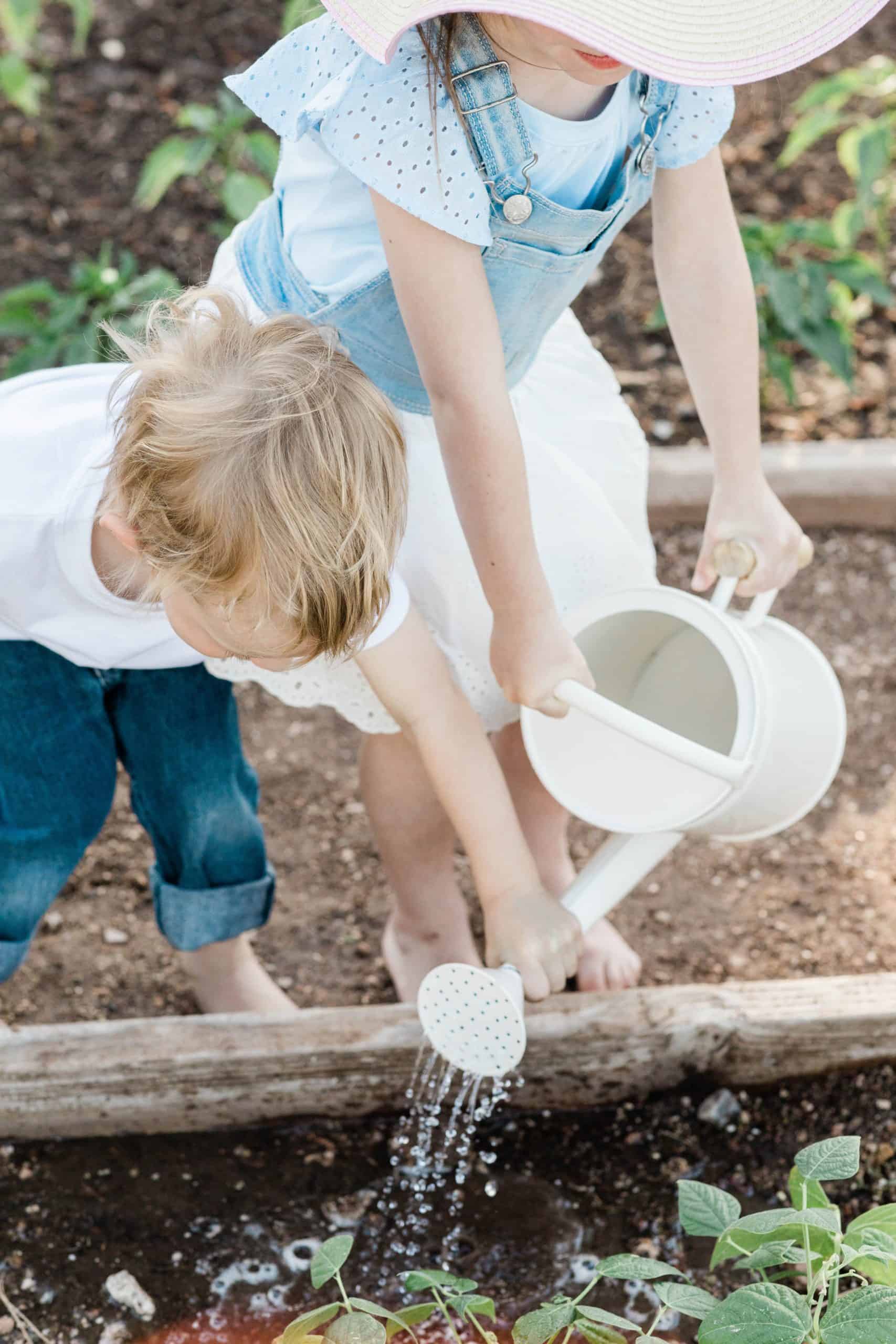 Children watering plants