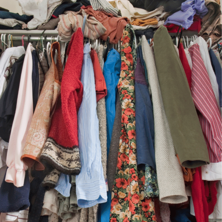 Closet stuffed with clothes