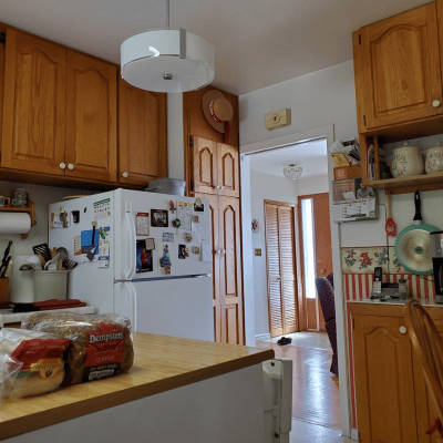 Staging a dated kitchen with wallpaper and clutter
