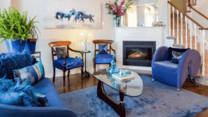 Home staging basics : Re-arranging furniture, adding in artwork and flowers make a staged living room feel more like home