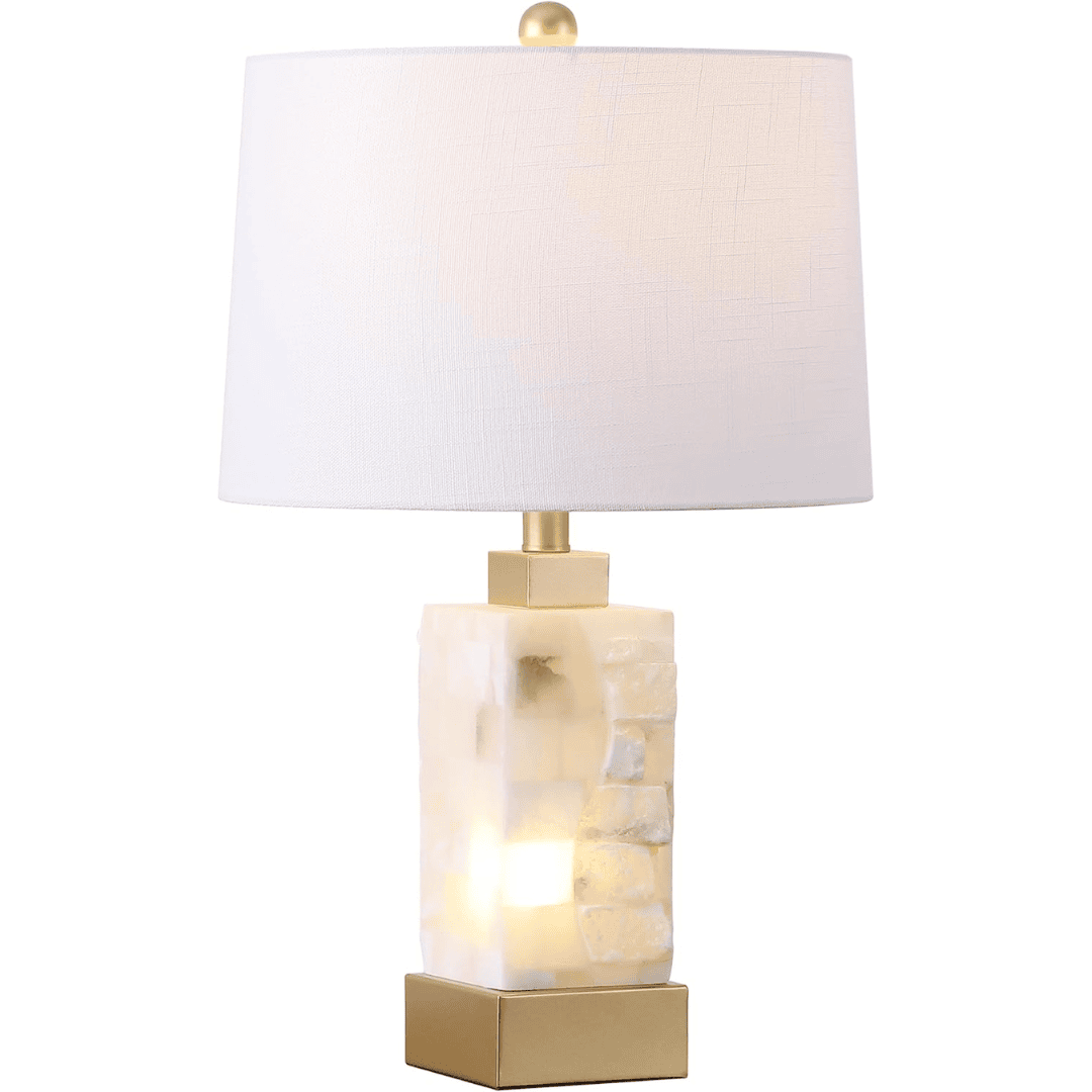 Modern alabaster table lamp with a soft white glow. Adds simple elegance to any coastal blue bedroom.