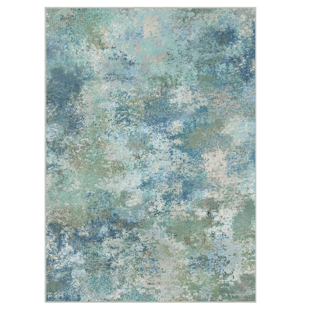 Soft washable rug with a blue-green abstract pattern. Low-pile, non-slip, and easy to maintain.