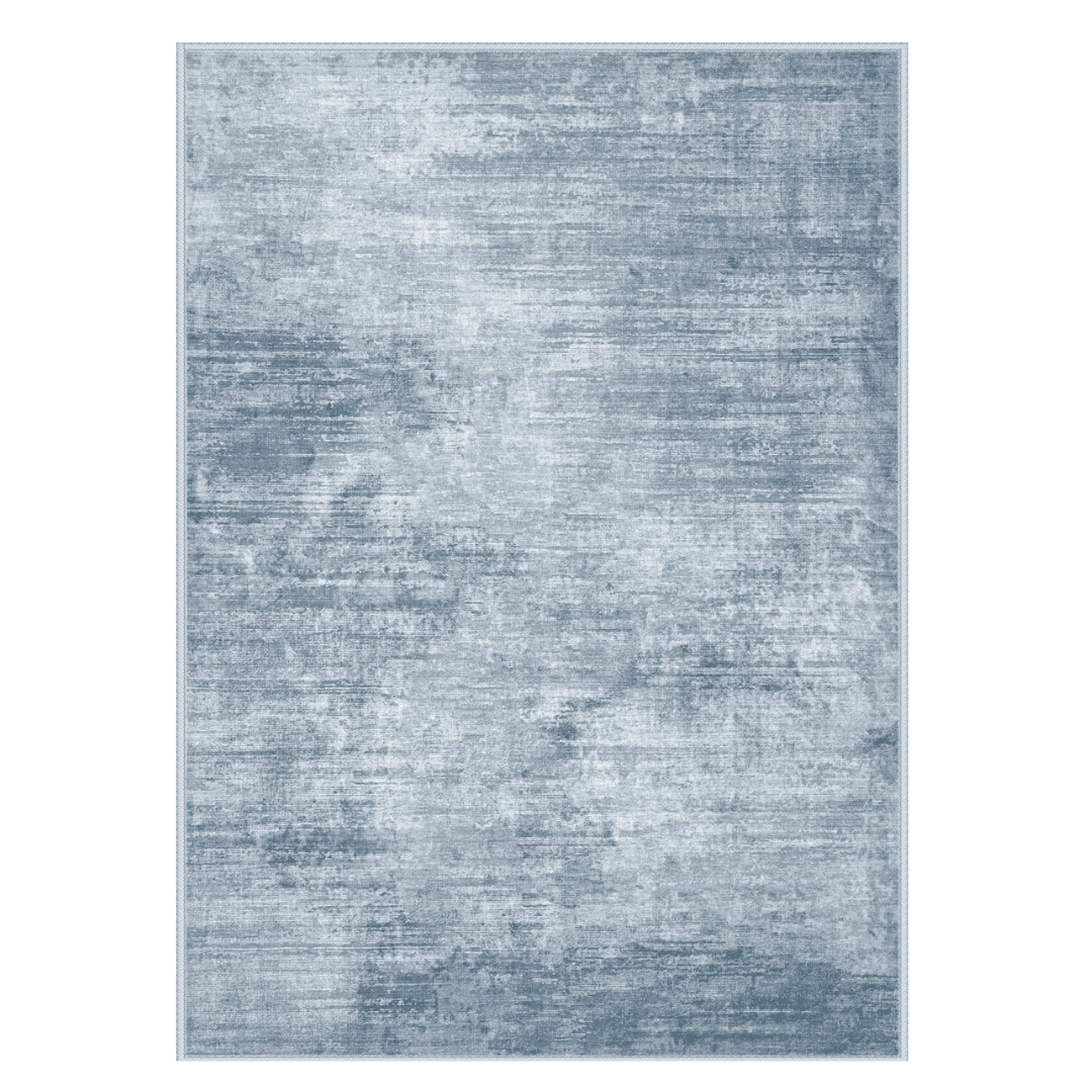 Soft washable rug with a modern abstract pattern. Low-pile and non-slip for easy layering in any space.