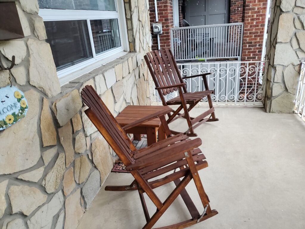 Cozy Fall Outdoor verandah with 2 chairs and a small table