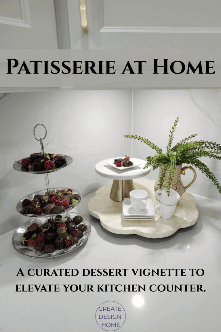 Kitchen countertop styled with espresso cups, tiered tray with chocolates