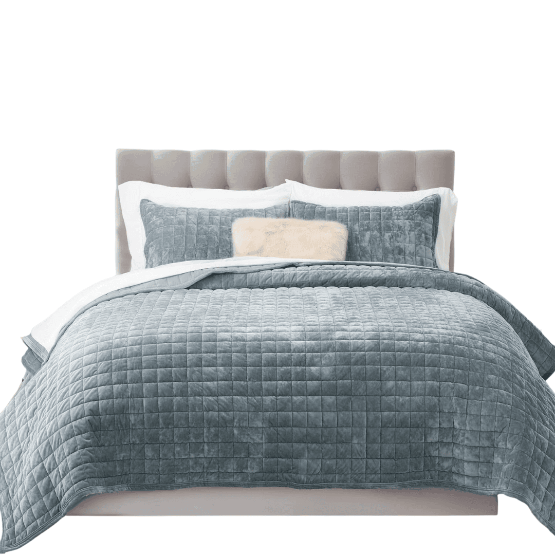 Soft velvet quilt set with a subtle channel-stitch pattern. Lightweight, ultra-soft, and perfect for layering in a coastal blue bedroom.