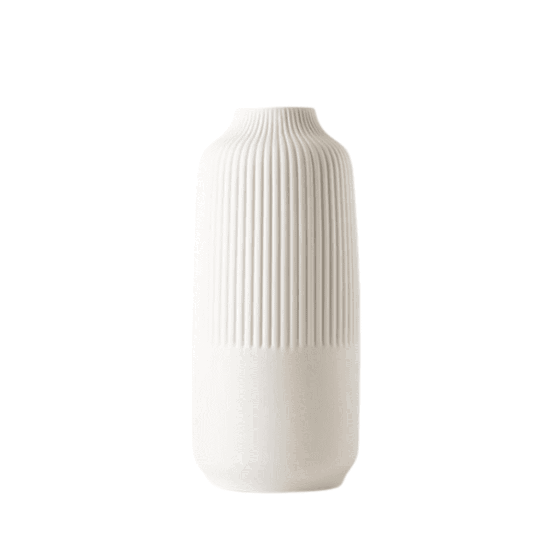 A matte white, minimalist vase that adds soft texture and modern elegance to any styled vignette.
