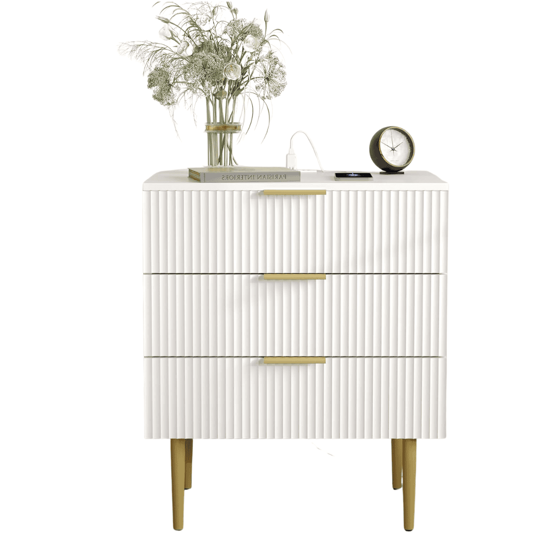 White fluted nightstand with roomy drawers and built-in charging ports. A chic, functional bedside piece.