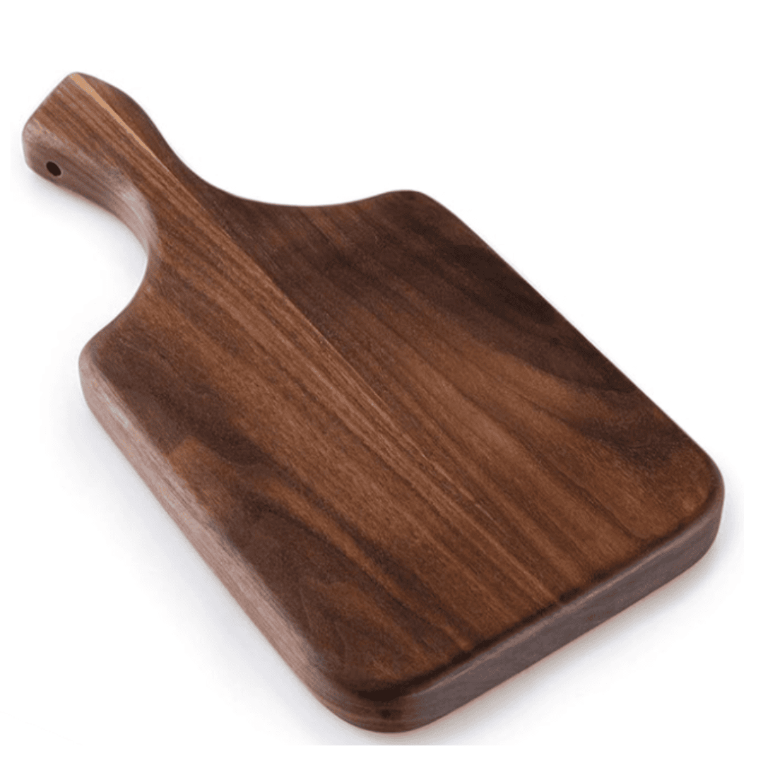 A rich, dark walnut board with artisan craftsmanship — ideal for small prep tasks or styled charcuterie moments.
