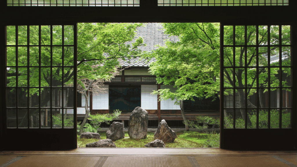 Japanese tea house with garden behind it