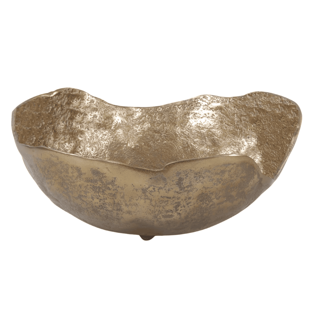 Organic shaped metal bowl adds warmth and visual weight.