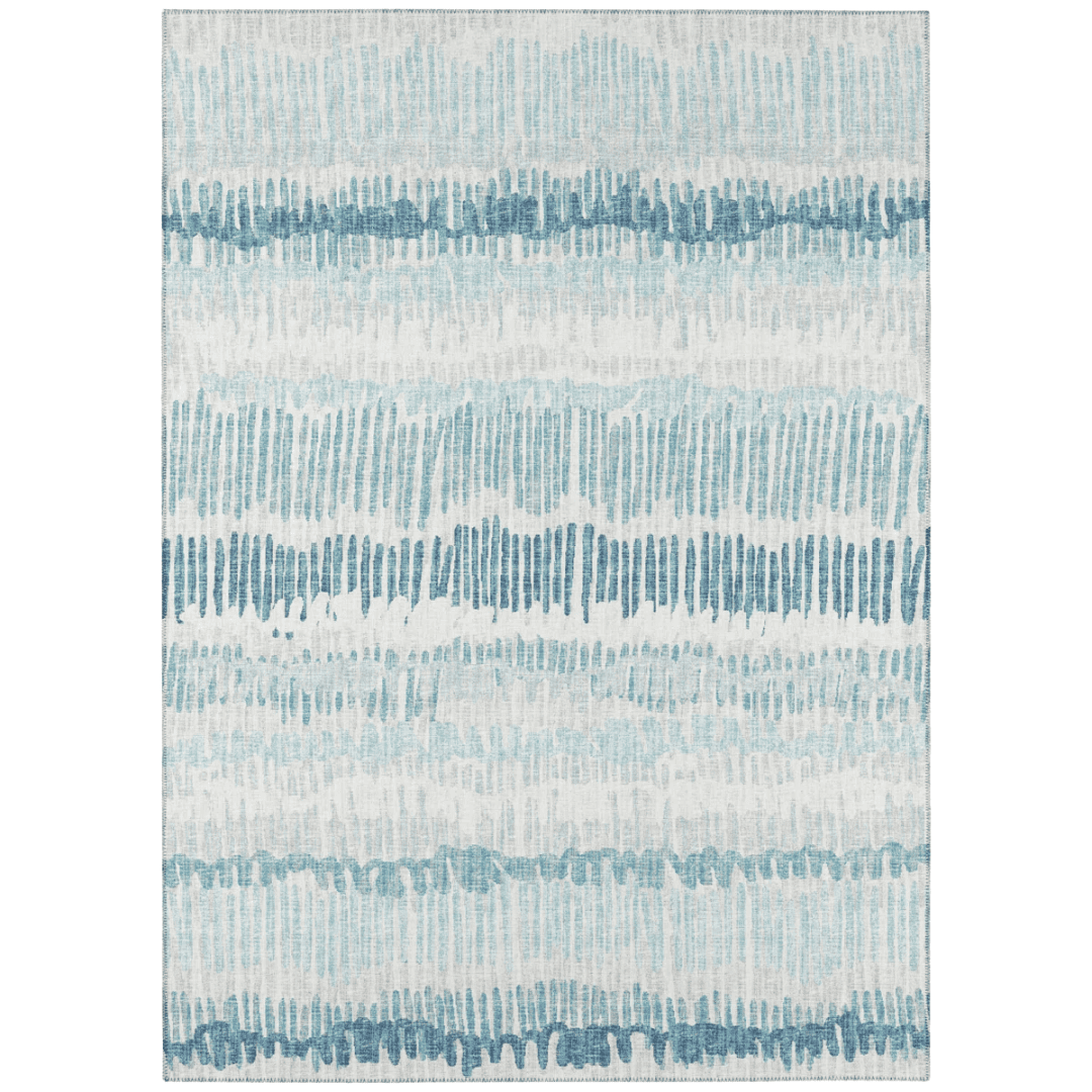 Durable striped rug in soft neutrals, suitable for indoor or covered outdoor spaces.