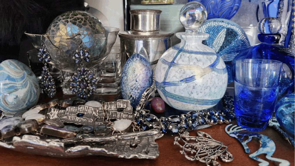 Array of jewellery and perfume bottles and little accessories