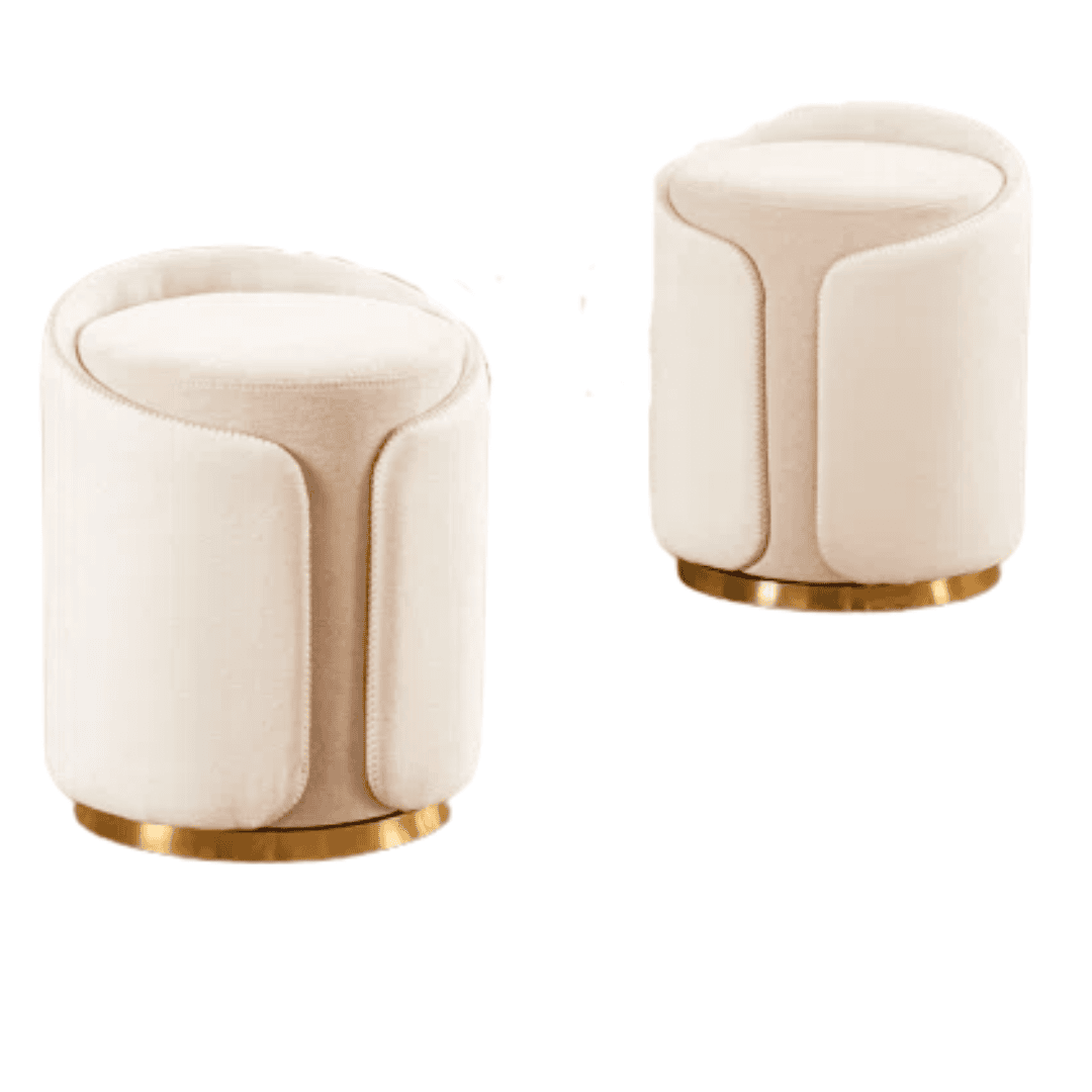 Ottomans Compact swivel ottomans with soft curves and warm metallic detail.