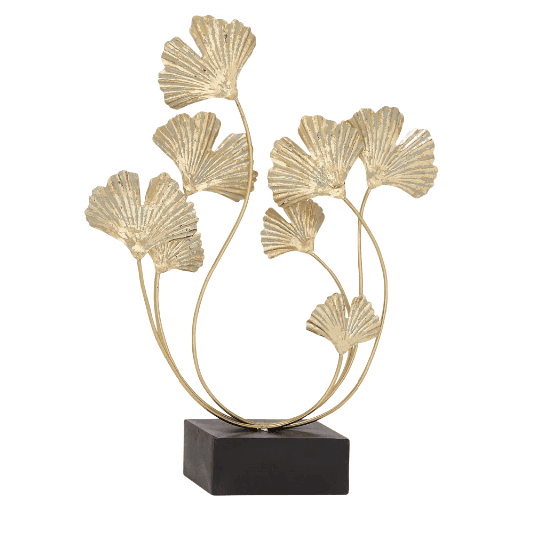 Sculptural gold floral accent adds organic movement and warmth