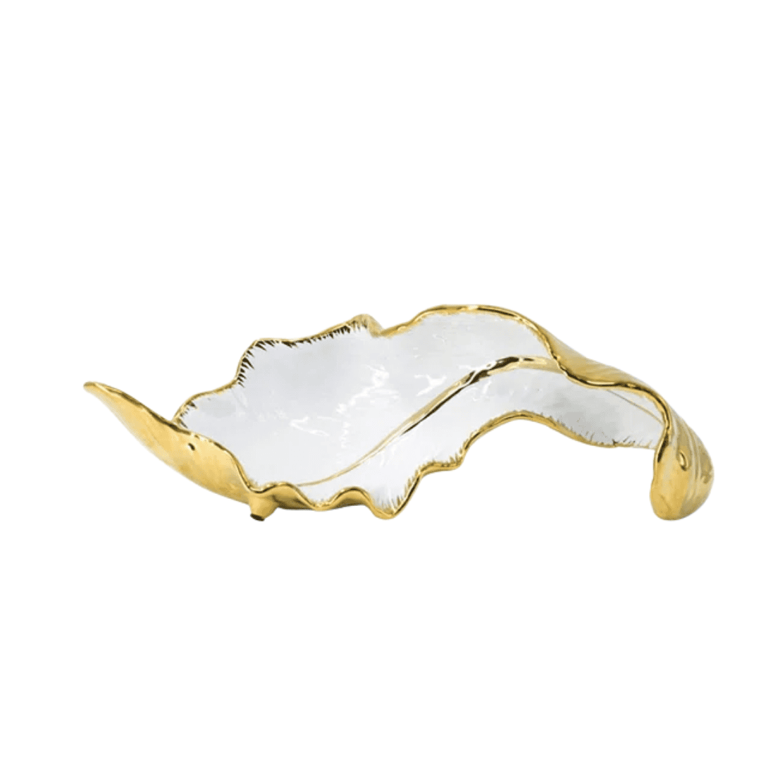 Ceramic leaf sculpture with soft curves and refined gold accents