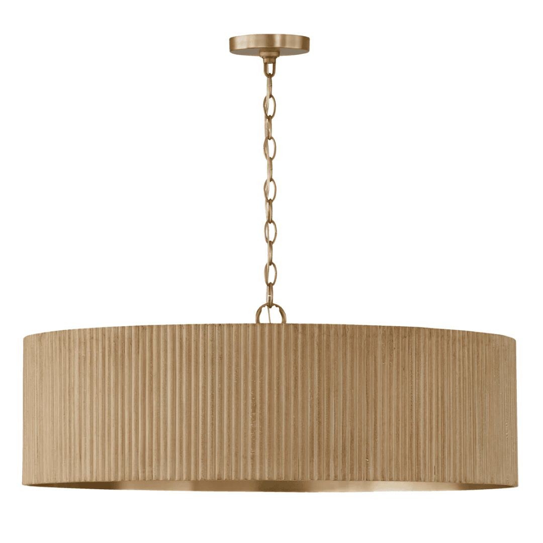 Textured drum chandelier with warm brass interior.