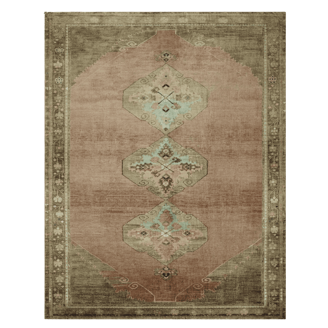 Muted vintage-style rug grounding the space with soft colour
