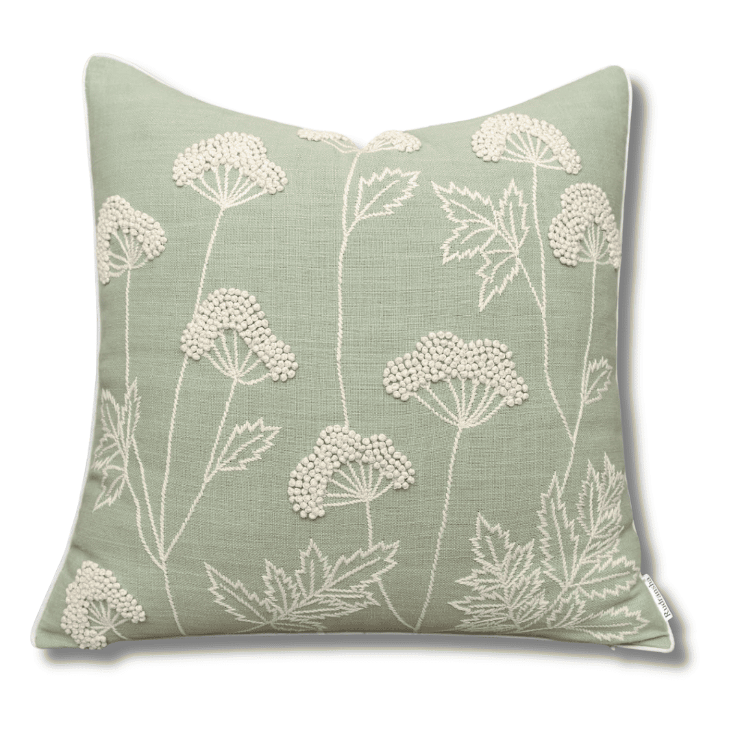 Sage green embroidered throw pillow with botanical pattern