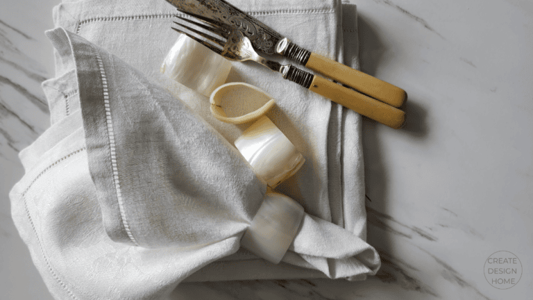 Neutral linen napkin with chopsticks and ceramic rings styled for Seiri, putting in order