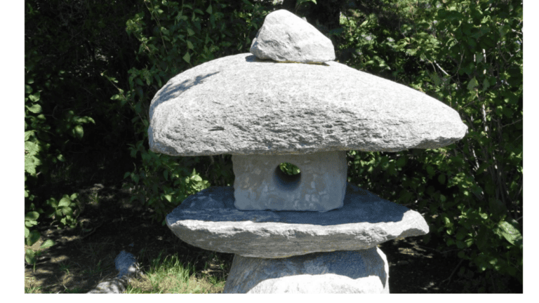 Stone garden lantern representing Ichigo Ichie, one moment one meeting, and quiet reflection in nature.
