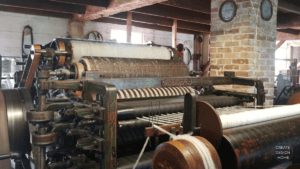 Historic textile machinery representing Kaizen, continuous improvement through steady refinement and thoughtful work.