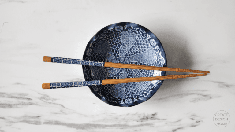 Blue patterned bowl with chopsticks styled to reflect Kanso, warm simplicity and intentional living.