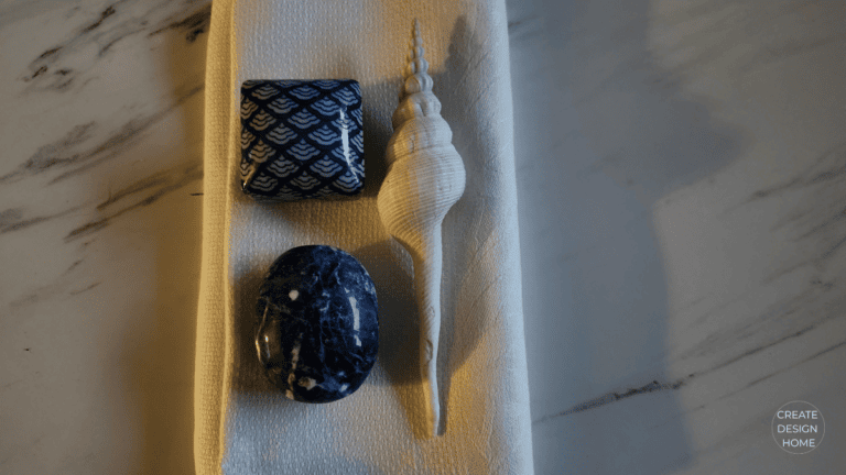 Minimal blue decorative objects styled to represent Kanso, warm simplicity and thoughtful design.