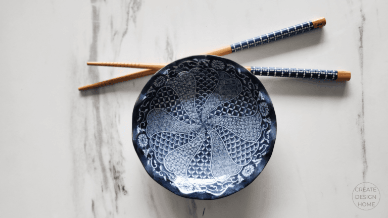 Blue patterned bowl and chopsticks reflecting Mushin, calm focus, and simple intentional living.
