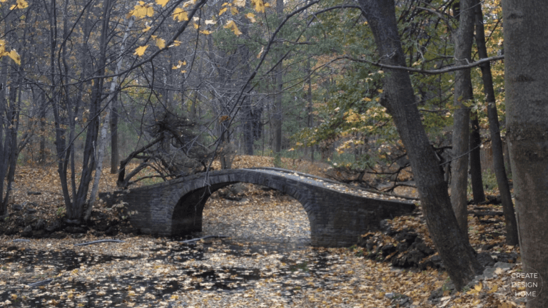 Stone bridge in autumn landscape representing Wabi-Sabi, beauty in imperfection through nature and time.