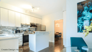 Bright staged kitchen with white cabinetry and clean countertops