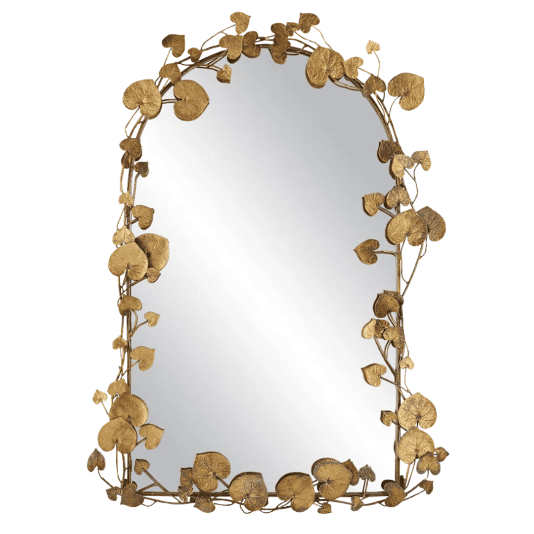 Arched brass wall mirror framed with handcrafted botanical leaf details