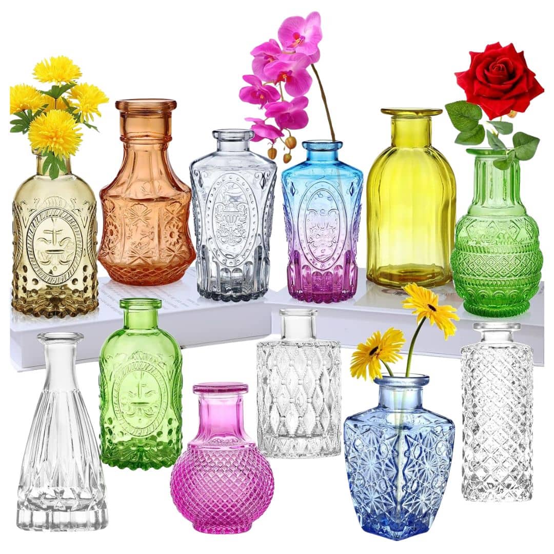 Colourful glass bud vases filled with flowers for an English garden tablescape.