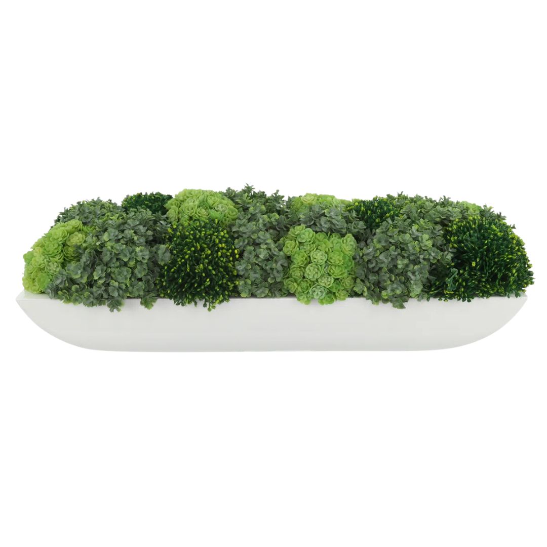 Faux green succulent arrangement in low white planter