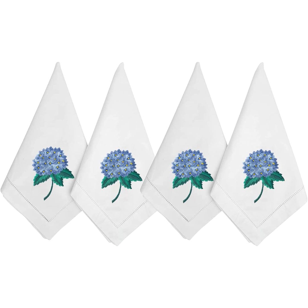 White cloth napkins embroidered with blue hydrangeas