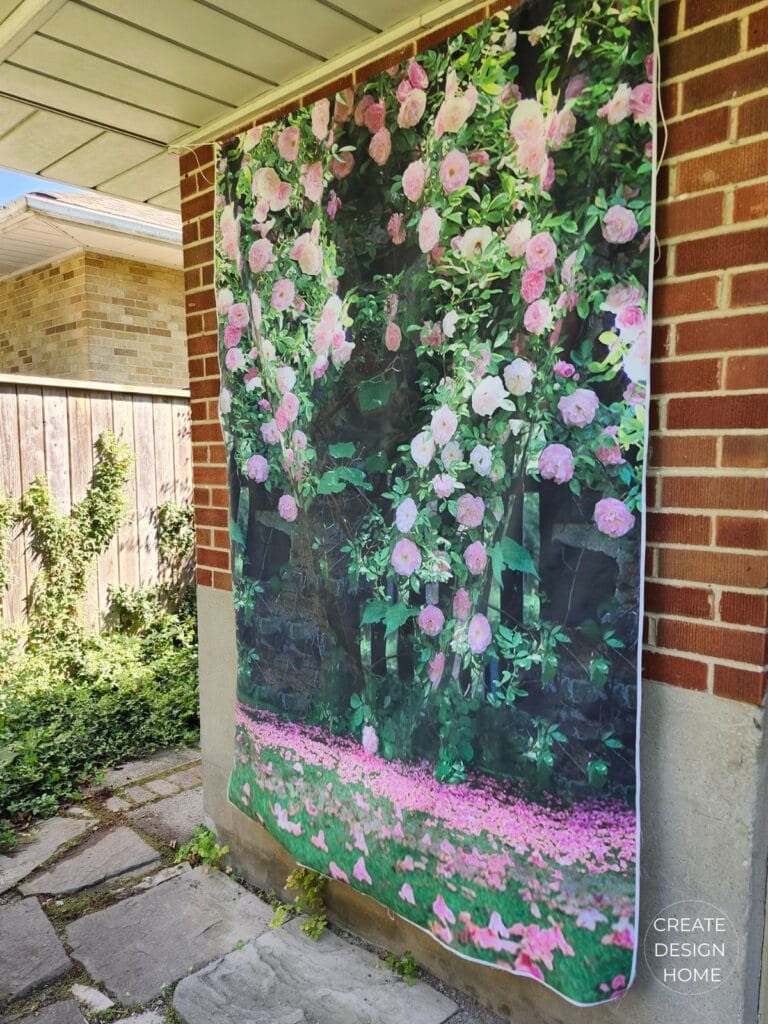 English country garden floral backdrop used as a photo area for a summer tea party.