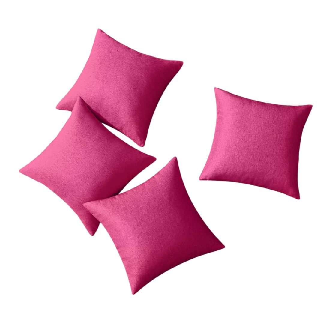 Bright pink outdoor throw pillows for garden party seating.