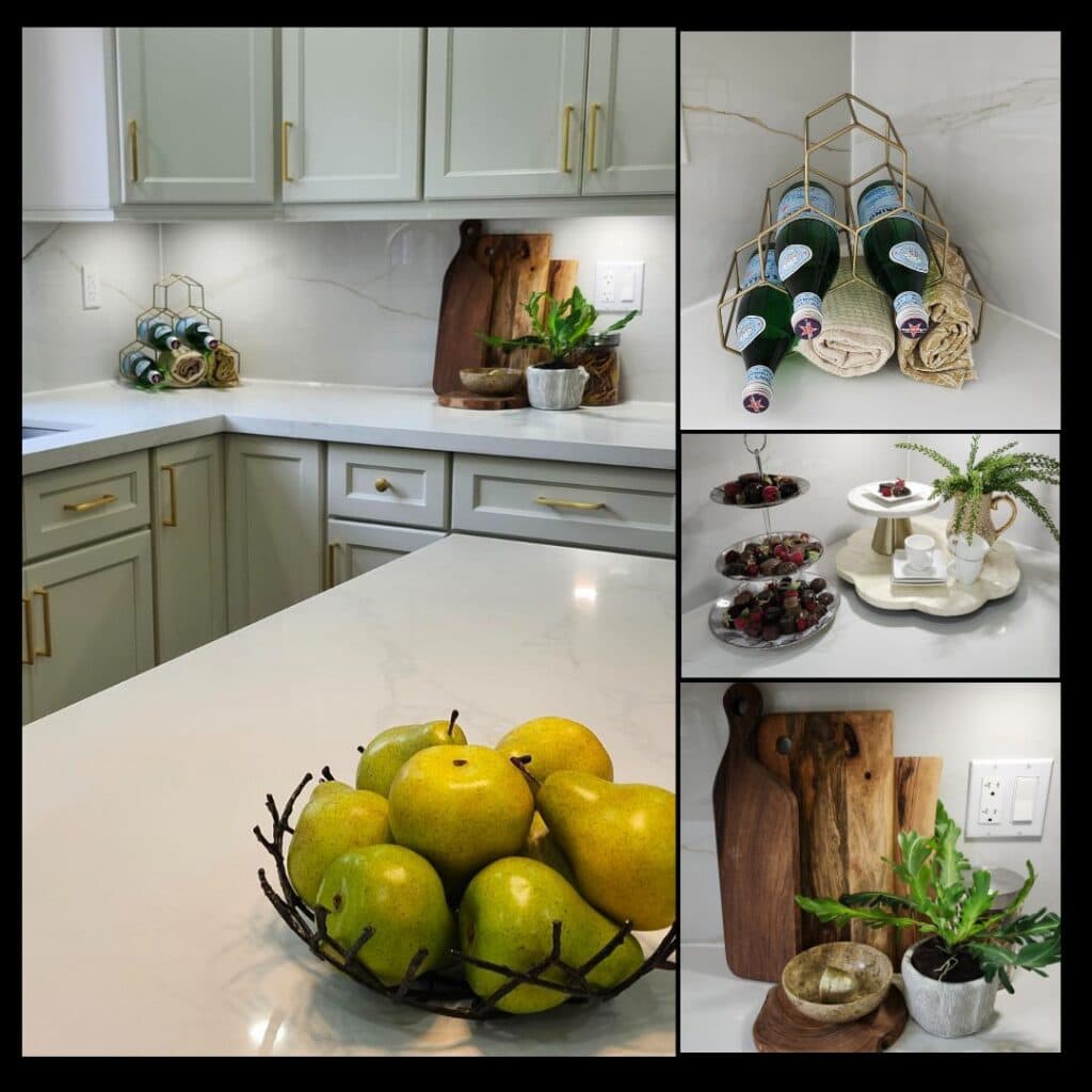 Styled kitchen countertop featuring cutting boards, fruit bowl, greenery, serving pieces and elegant countertop accessories.