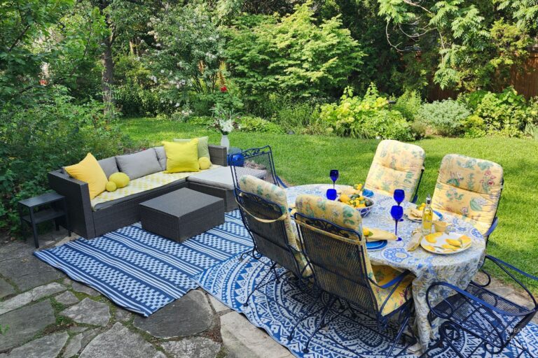 Lemon-inspired outdoor table setting with yellow accents in a summer garden