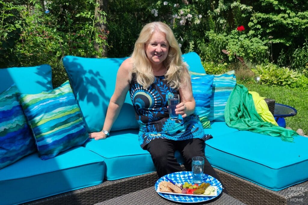 Summer garden refresh with turquoise outdoor cushions and blue and green accent pillows